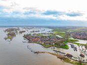 Hoogwater in Woudrichem van VVV Biesboschlinie